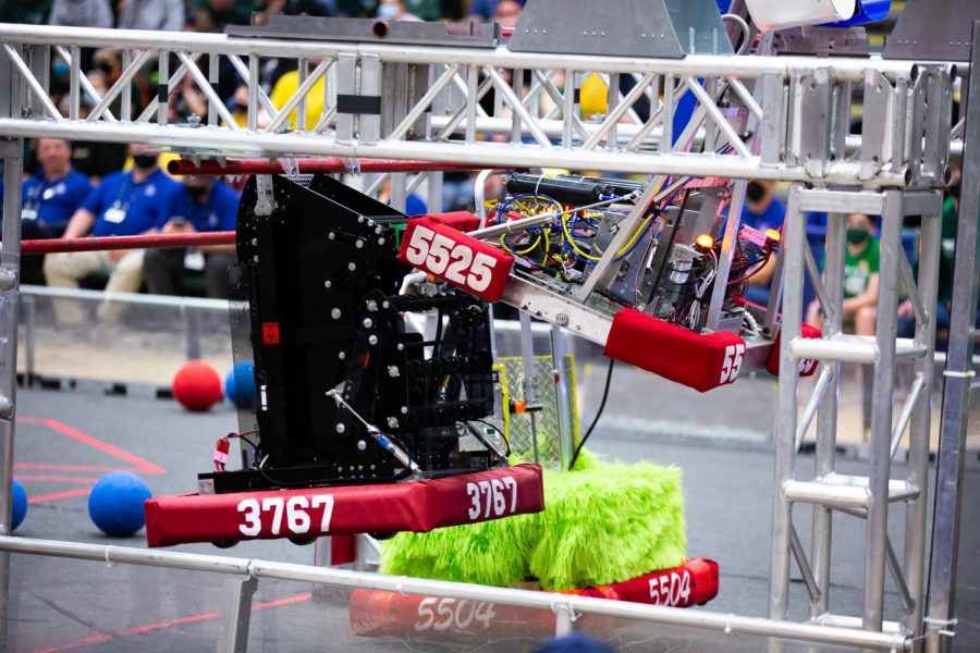 Titan Robotics (3767) has their robot hang at the end of a match with their alliance: The Loose Connections (5504) and Alacona Tool Cats (5525).