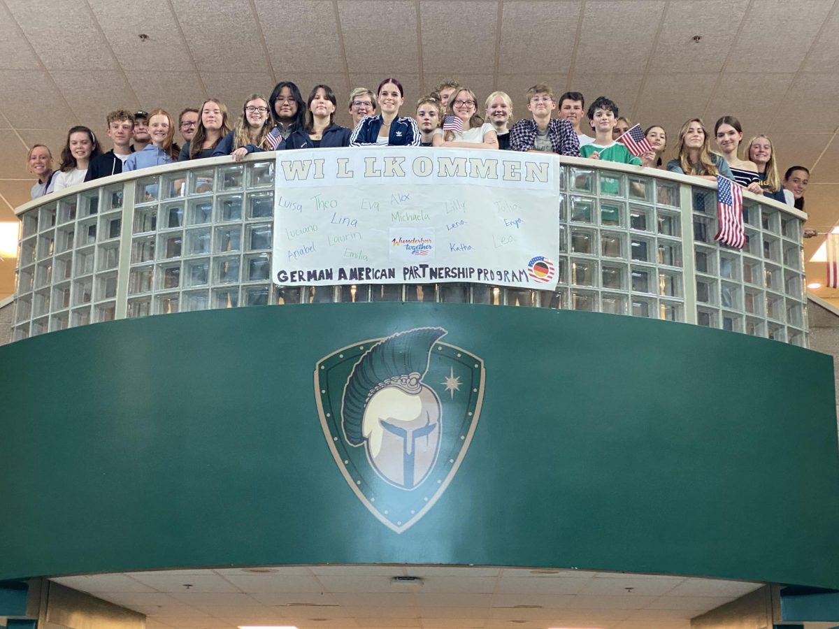 West and exchange students gather together around the banner for a final goodbye photo with all of them. Taken on Sept. 20. Photo courtesy: Kerry LaBonte. 
