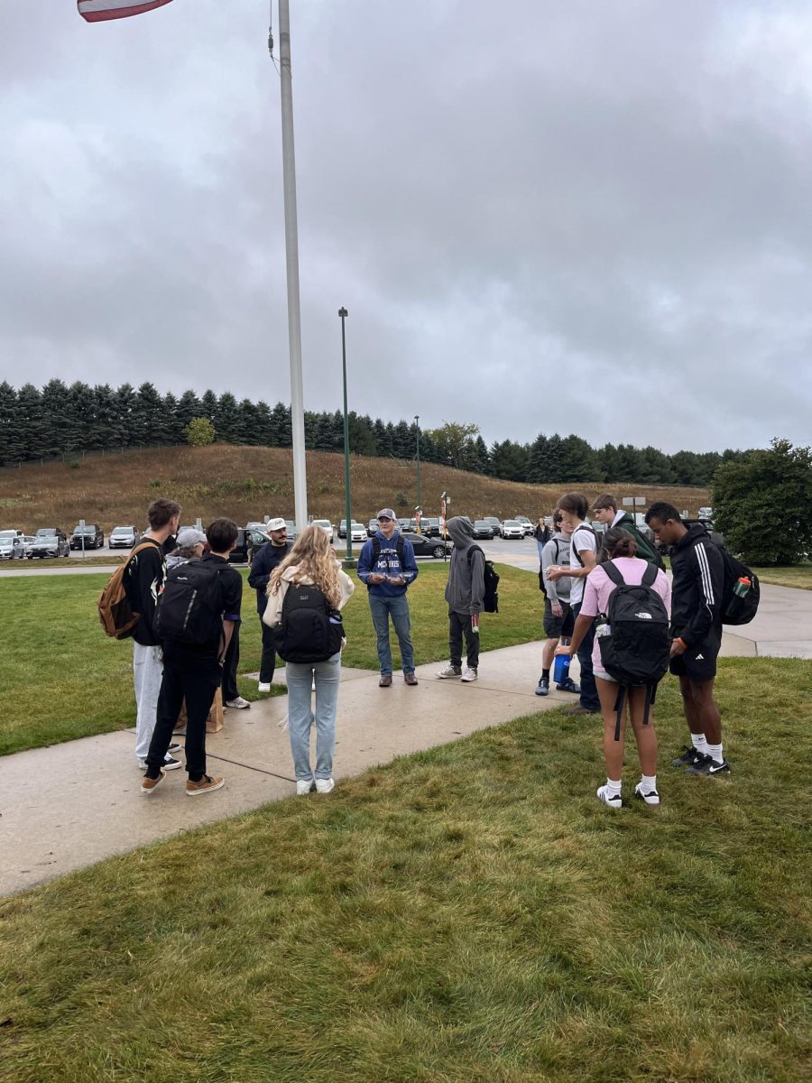 Students gather around the flagpole outside of the school for prayers. Photo Courtesy: Kaylyn Habers.