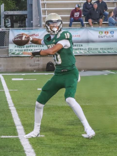 Warming up his arm, Sophomore Brayden Tillman gets some throws in pregame. Photo courtesy of Brayden Tillman