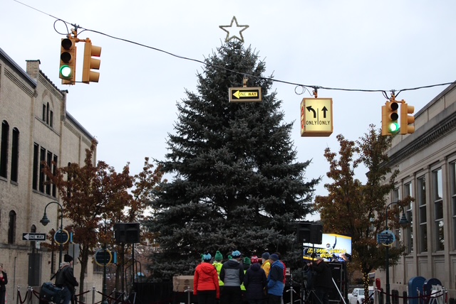 Many people show up to the parade earlier to get a good spot for the lighting. Before the lighting and parade the organization passes out candy to kids instead of during the parade for a safer environment. Photo Credit: Jojo Tarchack-Hiss