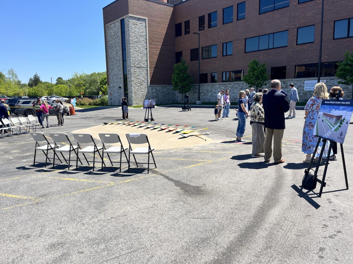 During the ground breaking event, local community members lined up behind the shovels to break ground.