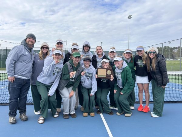 The Girls Tennis Team pose and celebrate after winning the BNC meet. “ Well, my favorite memorable moment is winning BNC because it's the first time that we've ever won in all of West tennis varsity girls history. So it was kind of a revolutionary experience,” Lauters said.